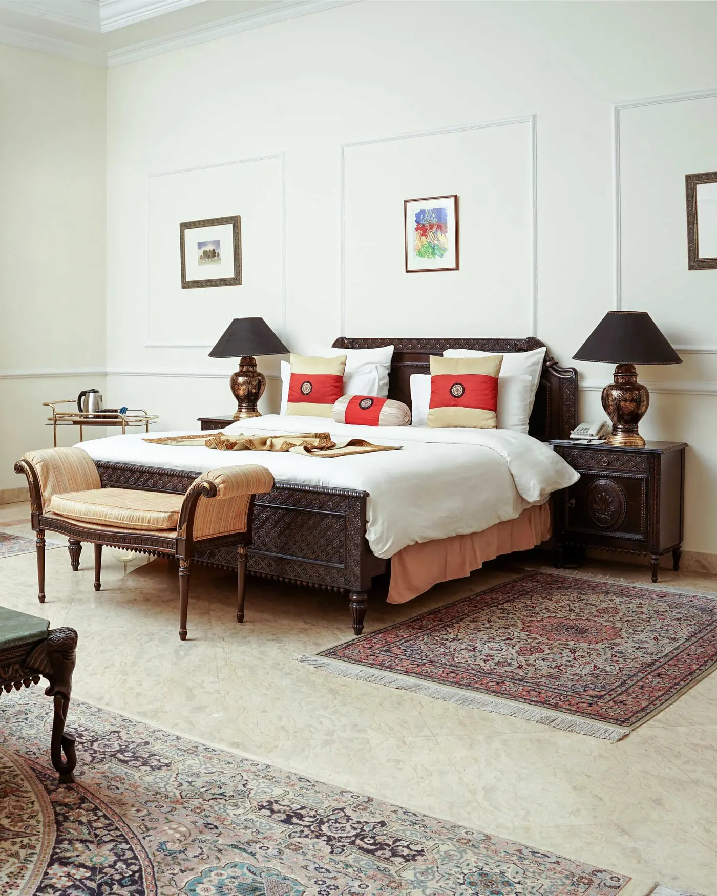 Standard Room at Etihad Club, with a dark wood bed and a panelled wall