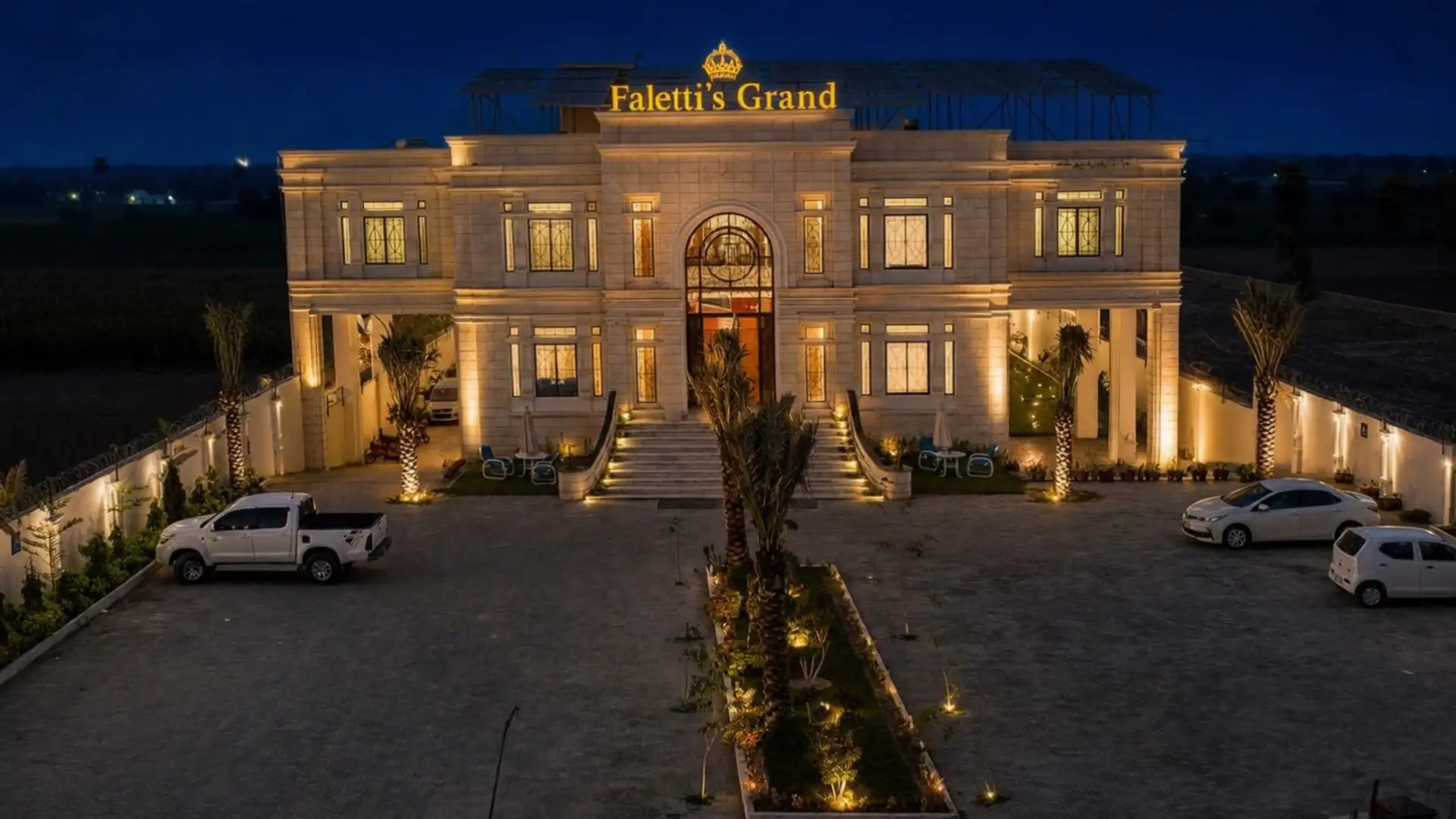 Faletti’s Grand Bahawalpur at dusk, its long floodlit frontage and forecourt beneath the gold sign