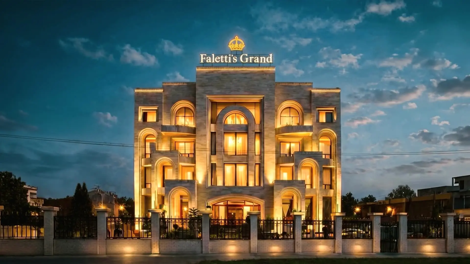 Faletti’s Grand Gujranwala at dusk, its floodlit facade and balcony beneath the gold sign