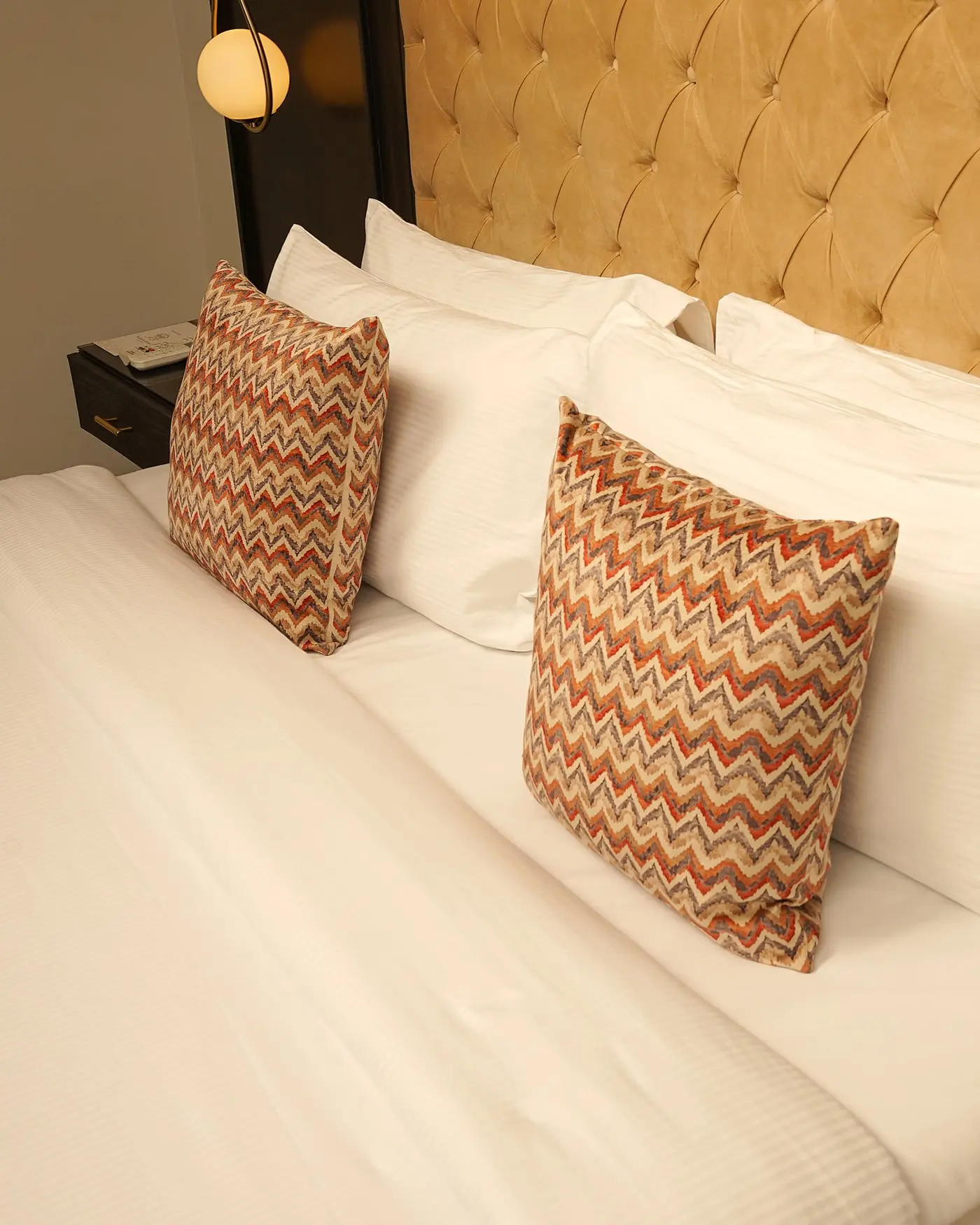 Bedding and cushions in a guest room