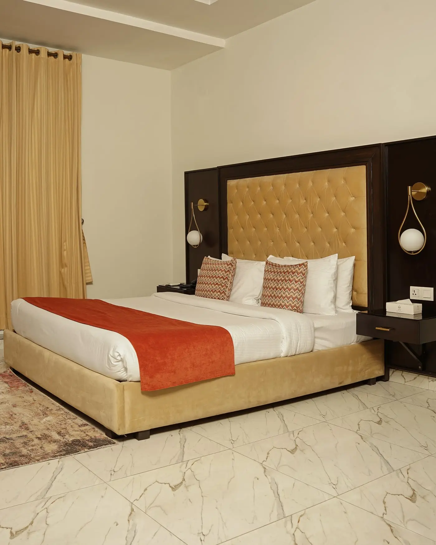 A standard room with a king bed at Faletti’s Grand Gulberg