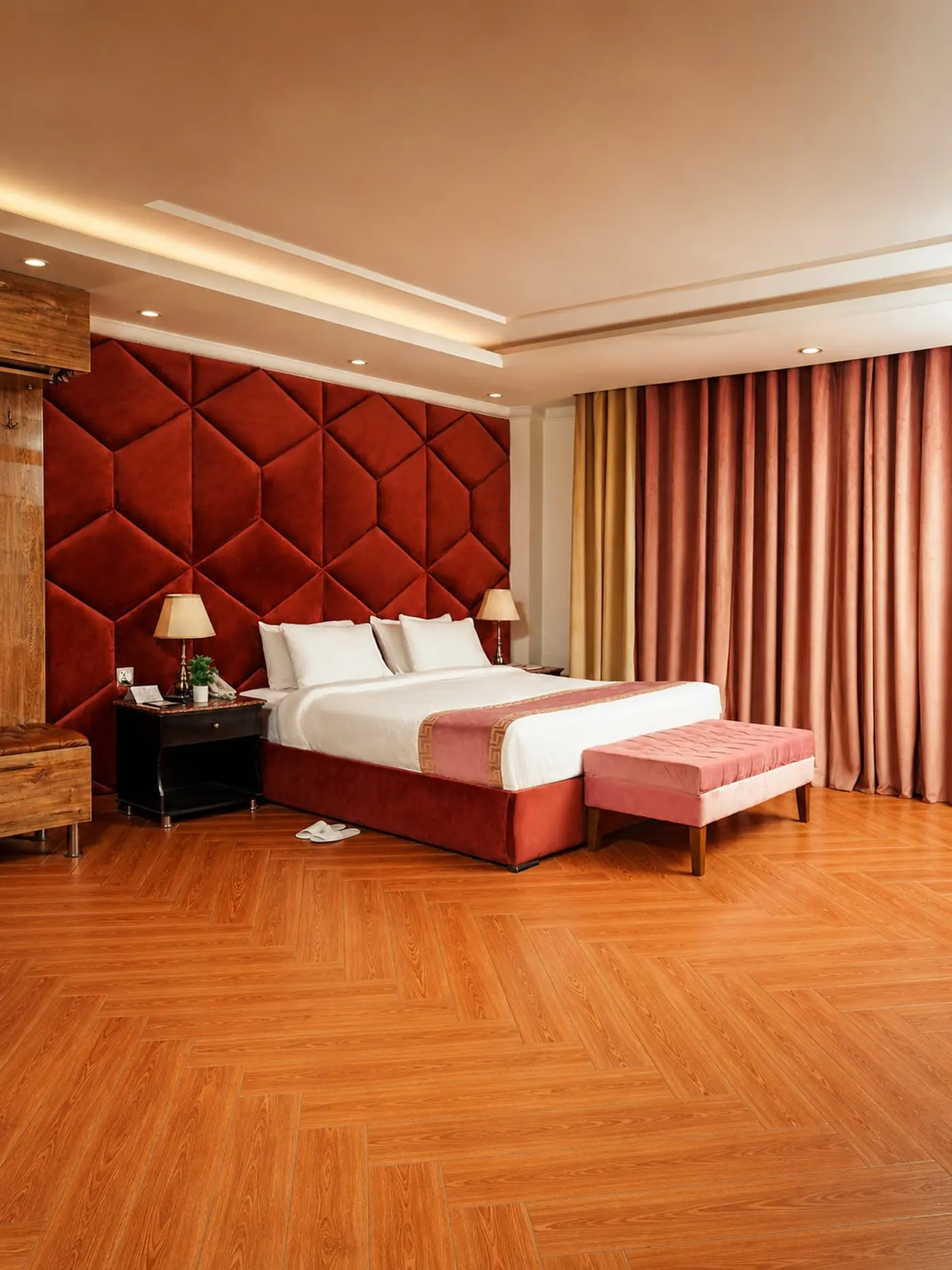 A room with a deep-red tufted feature wall