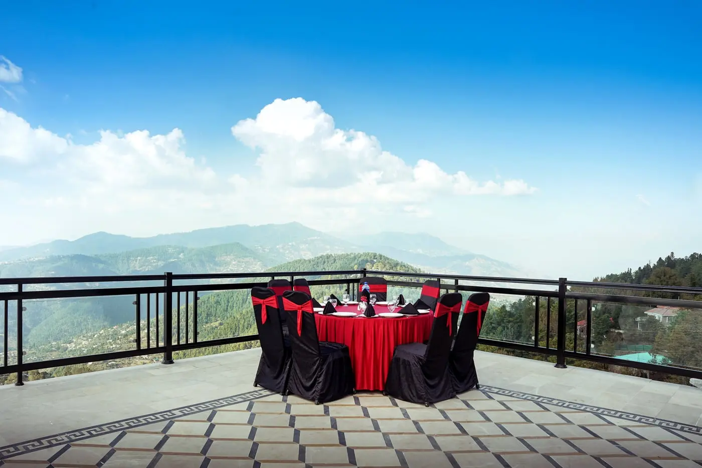 The rooftop terrace laid for dinner above the valley