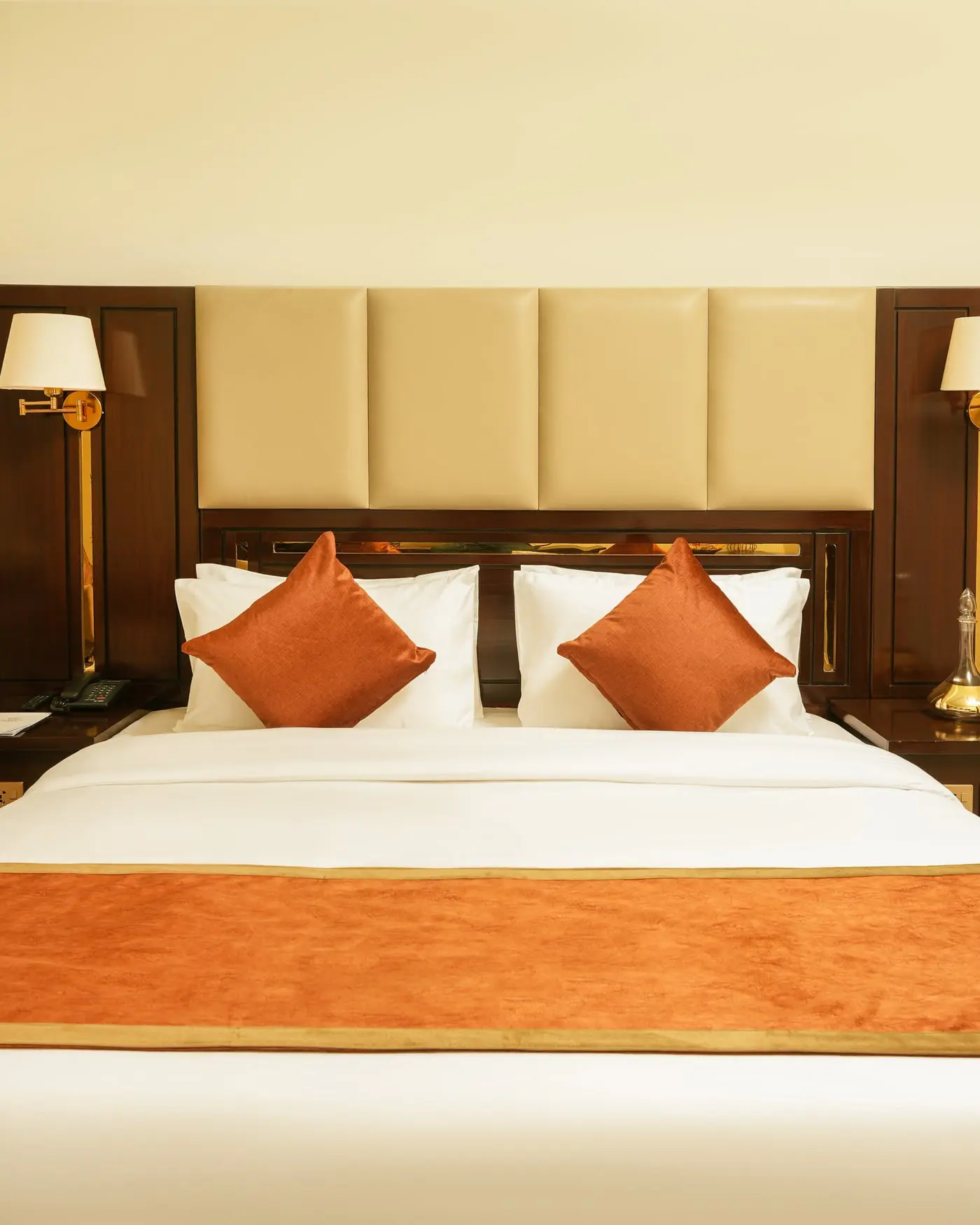 A king bed and padded headboard at Faletti’s Residences Top City