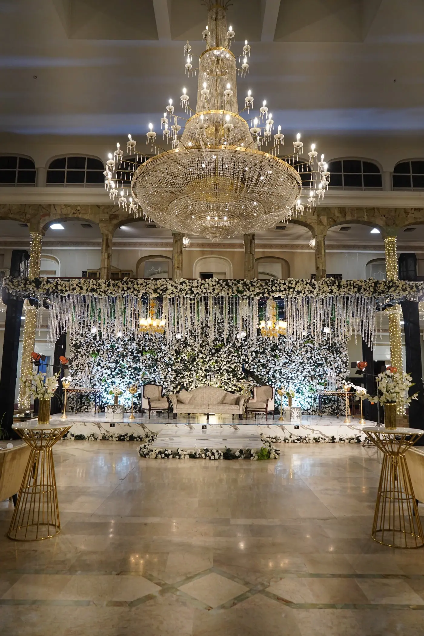 The chandelier and floral stage in the banquet hall